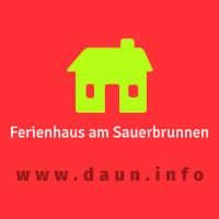 A simple, stylized house symbol on a red background. It advertises a holiday home at the Sauerbrunnen with a website address.