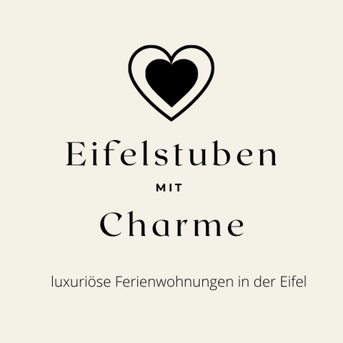 Ein elegantes Logo mit dem Schriftzug „Eifelstuben mit Charme“. Es bietet luxuriöse Ferienwohnungen in der Eifel an.