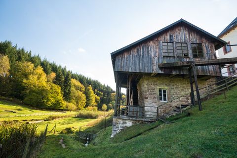 Old cutting mill near Meisburg in an autumnal landscape.