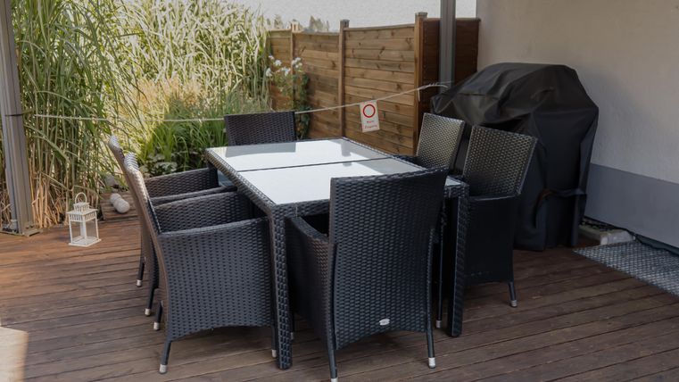 Outdoor dining area with grill