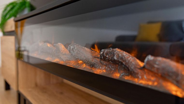The electric fireplace creates a cozy atmosphere.